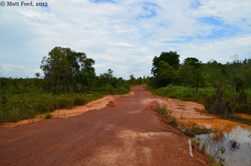 Construction of an embankment to allow passage of vehicles appeared to explain formation of the open inundated area.